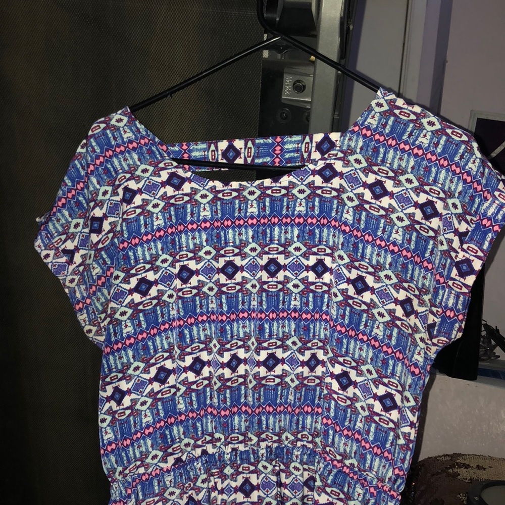 Women’s blue, knee length, sleeveless dress.